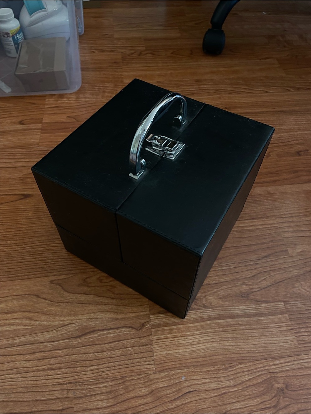 Black makeup box with silver handle hardware